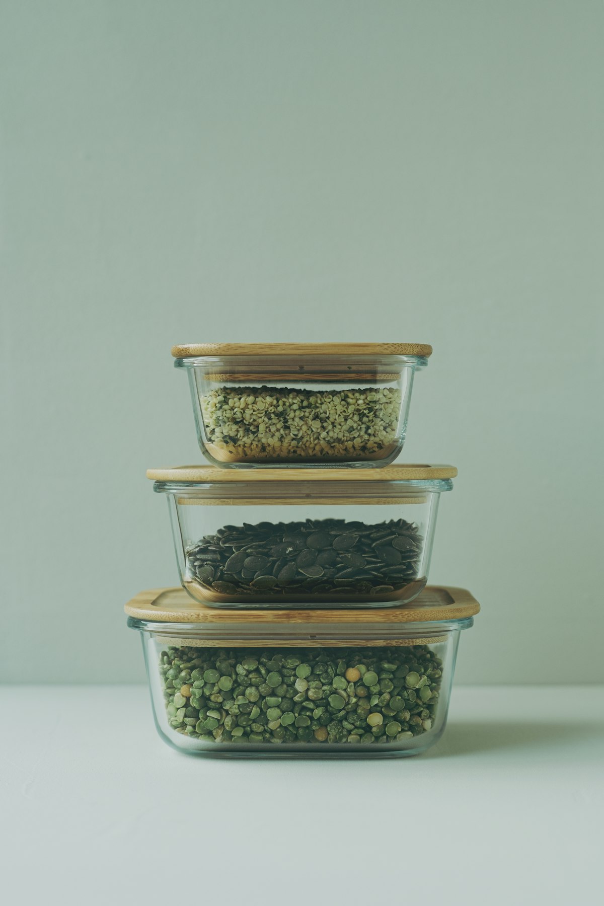Glass meal prep containers filled with colorful food